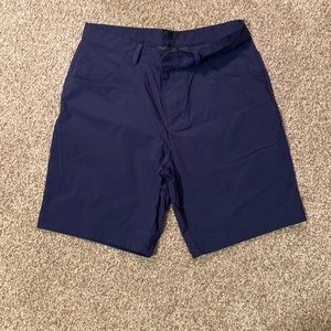 Navy blue Adidas golf shorts.